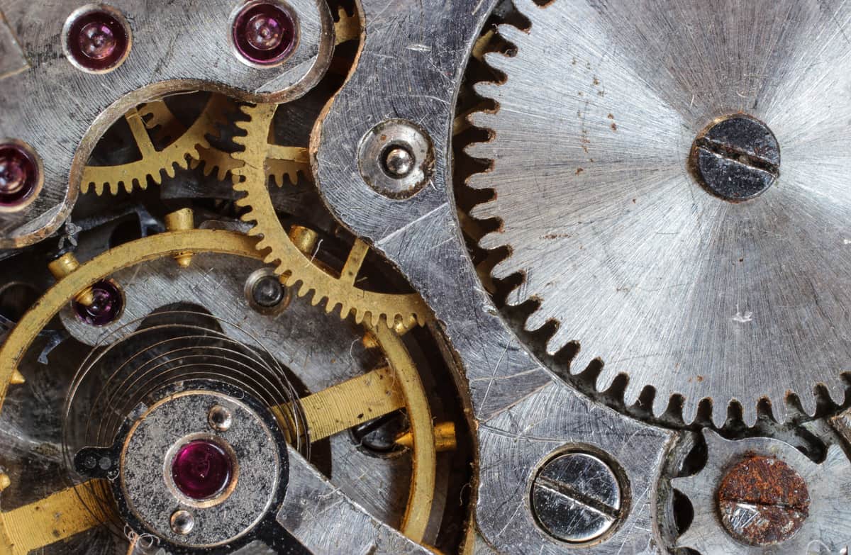 The exposed rotor and gears of an automatic watch movement